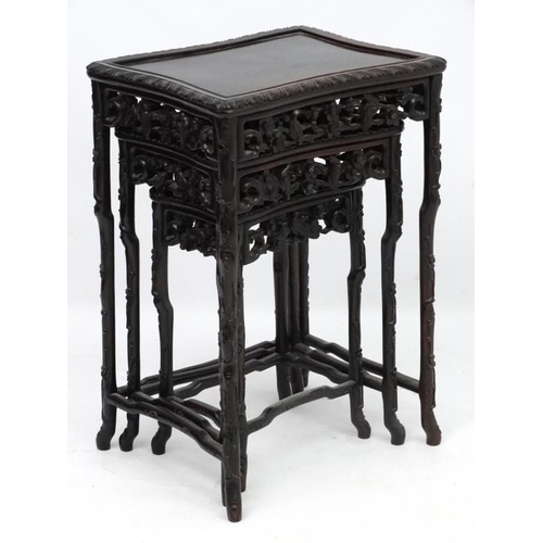 213 - Chinese : a patinated Zitan? Wood nest of three tables, with shaped legs, sides, front and back of t... 