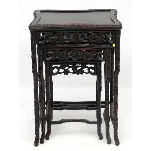 213 - Chinese : a patinated Zitan? Wood nest of three tables, with shaped legs, sides, front and back of t... 