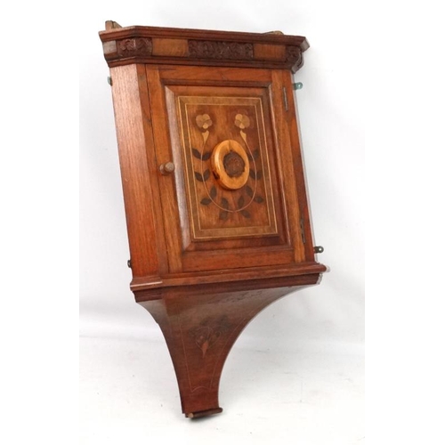 215 - A 19thC Dutch oak and walnut marquetry inlaid and carved corner cupboard 41'' high