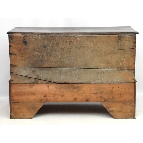 217 - An early 18thC oak four panelled mule chest with 3 drawers under ( the central 2 panels now opening ... 