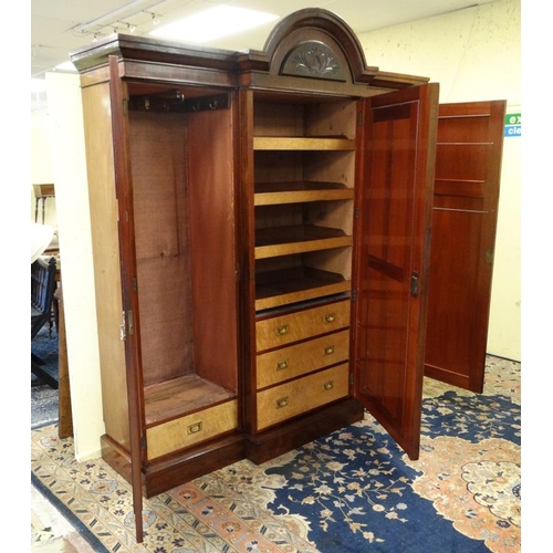 219 - A 19thC mahogany breakfront triple wardrobe with central section with drawers and linen sides 94'' h... 