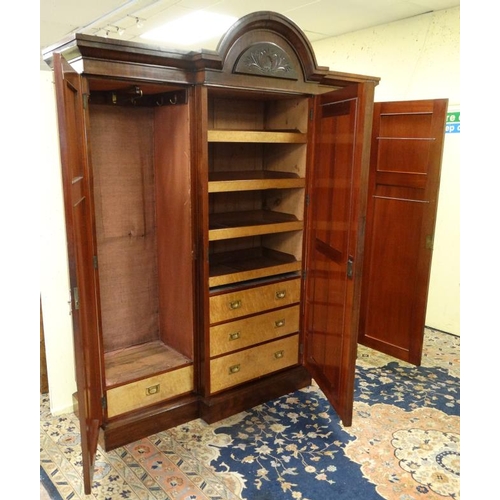 219 - A 19thC mahogany breakfront triple wardrobe with central section with drawers and linen sides 94'' h... 