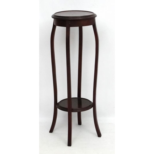 220 - A c.1900 mahogany circular 2-tier plant stand. 36 1/2'' high x 12 1/4'' diameter