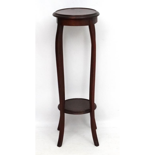 220 - A c.1900 mahogany circular 2-tier plant stand. 36 1/2'' high x 12 1/4'' diameter