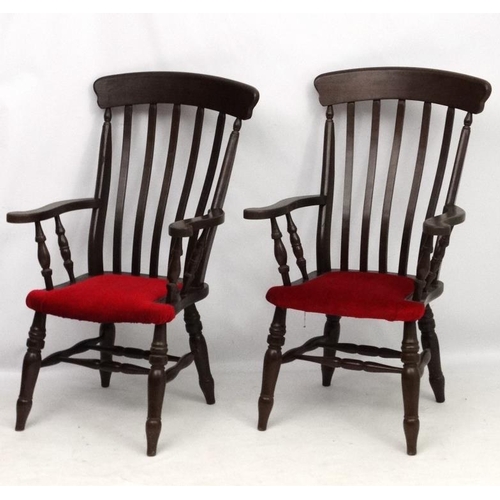 223 - A pair of mid 20thC lathe back armchairs with upholstery to seat and double stretchers 44 1/2'' high