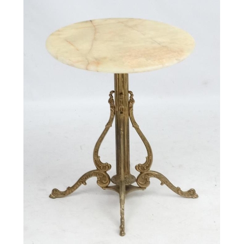 224 - Mid Century / Hollywood Regency :    A 1970's Onyx / marble  circular topped occasional table , with... 