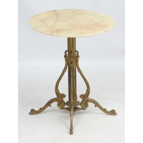 224 - Mid Century / Hollywood Regency :    A 1970's Onyx / marble  circular topped occasional table , with... 