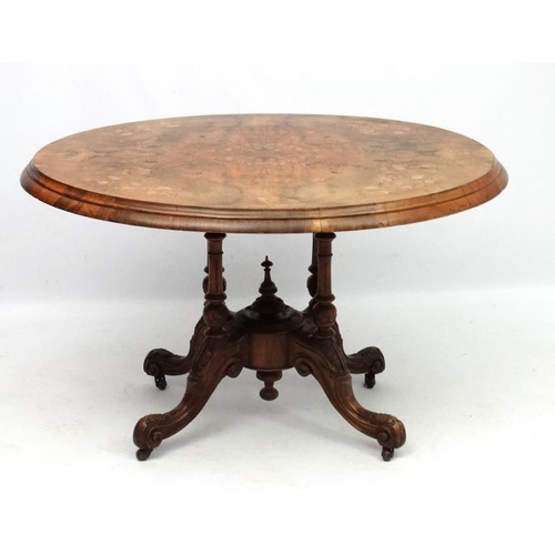 227 - A Victorian inlaid walnut oval tilt top centre table 45'' long x 34'' deep x 28'' high