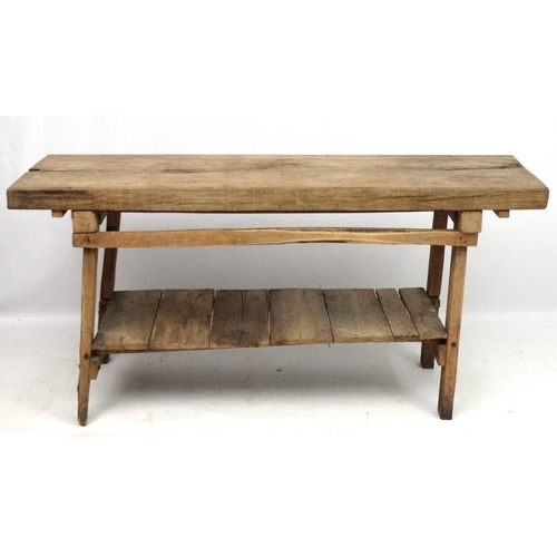 229 - A 19thC Continental oak Farmhouse kitchen block on stand with under tier shelf. 68'' long