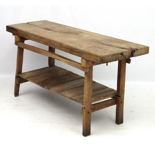 229 - A 19thC Continental oak Farmhouse kitchen block on stand with under tier shelf. 68'' long