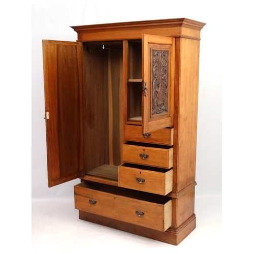 233 - A Victorian blonde walnut compactum style wardrobe 79 1/2'' high x 48'' wide