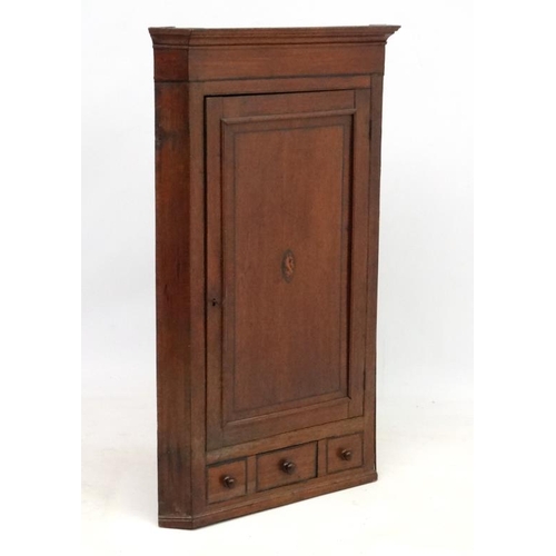 238 - A Georgian shell inlaid oak and cross banded mahogany corner cupboard with one real and 2 sham drawe... 