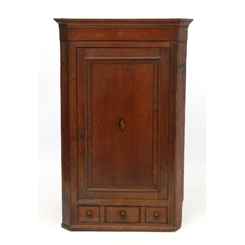 238 - A Georgian shell inlaid oak and cross banded mahogany corner cupboard with one real and 2 sham drawe... 