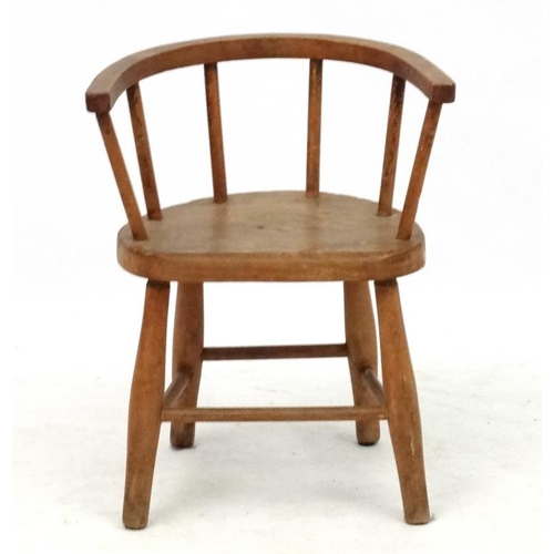 244 - A child's elm seated hoop back open armchair 19'' high x 15 1/4'' wide