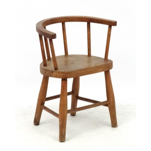 244 - A child's elm seated hoop back open armchair 19'' high x 15 1/4'' wide