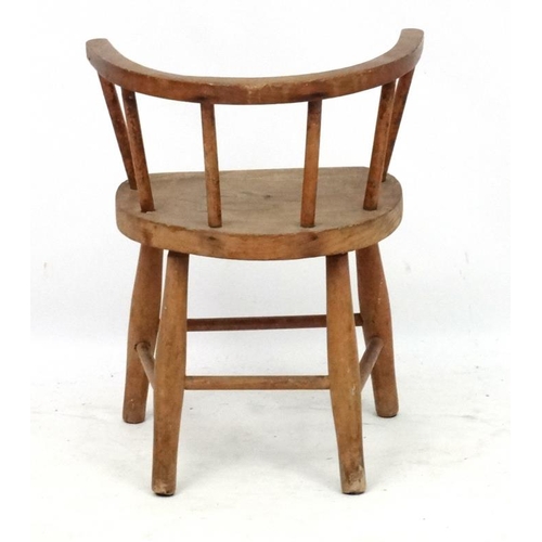 244 - A child's elm seated hoop back open armchair 19'' high x 15 1/4'' wide