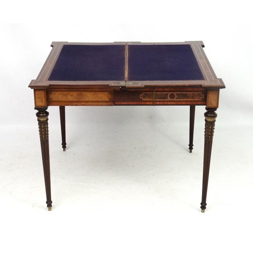 247 - A Louis XV French inlaid walnut card table with concertina action and ormolu mounts and walnut and b... 