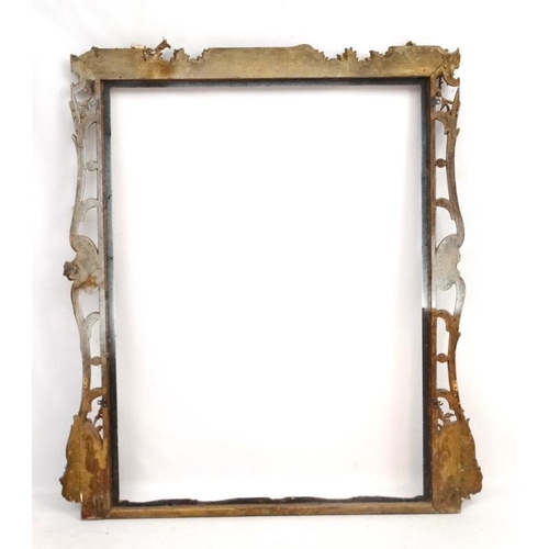 248 - Picture Frame :  an extremely  large gilt frame with pierced decoration , having the internal measur... 