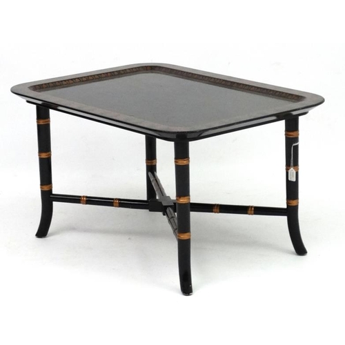 252 - A Regency style faux bamboo papier-mache coffee table with ebonised and gilt, lacquered detail 18'' ... 