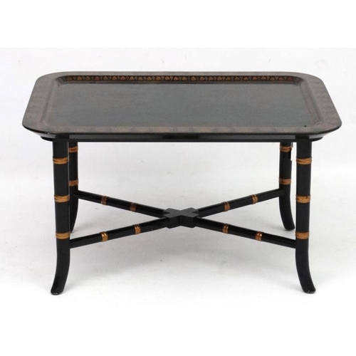 252 - A Regency style faux bamboo papier-mache coffee table with ebonised and gilt, lacquered detail 18'' ... 