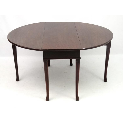 255 - A Geo III mahogany drop flap 6-legged table 55 1/4'' extended  x 29'' high