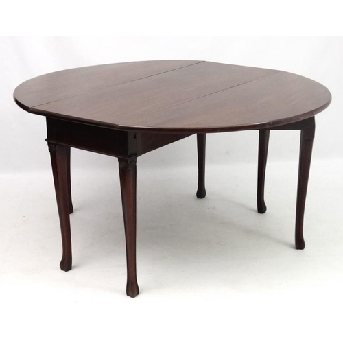 255 - A Geo III mahogany drop flap 6-legged table 55 1/4'' extended  x 29'' high