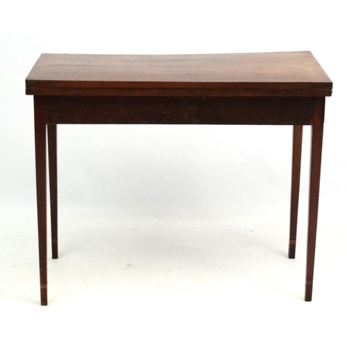 259 - An early 19thC mahogany fold over tea table with  stringing and single hinged leg 35 3/4'' wide