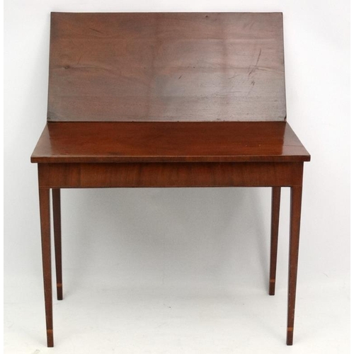 259 - An early 19thC mahogany fold over tea table with  stringing and single hinged leg 35 3/4'' wide