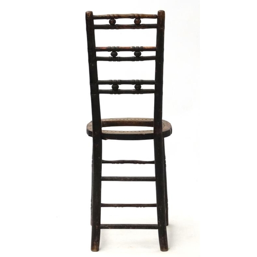 263 - A 19thC ebonised faux bamboo Mendlesham correctional chair 35'' high