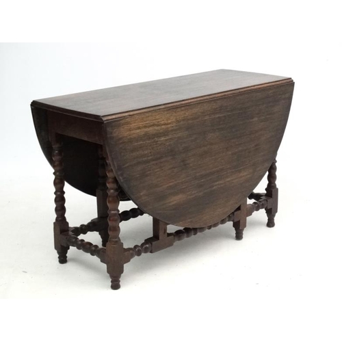 265 - A c.1900 peg jointed oak gate leg table with bobbin turned stretchers and legs etc. 46 1/2'' long x ... 