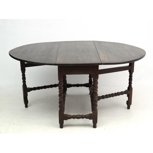 265 - A c.1900 peg jointed oak gate leg table with bobbin turned stretchers and legs etc. 46 1/2'' long x ... 