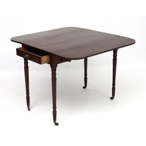 266 - A Geo IV mahogany Pembroke table with one true and one sham drawer. 35'' long