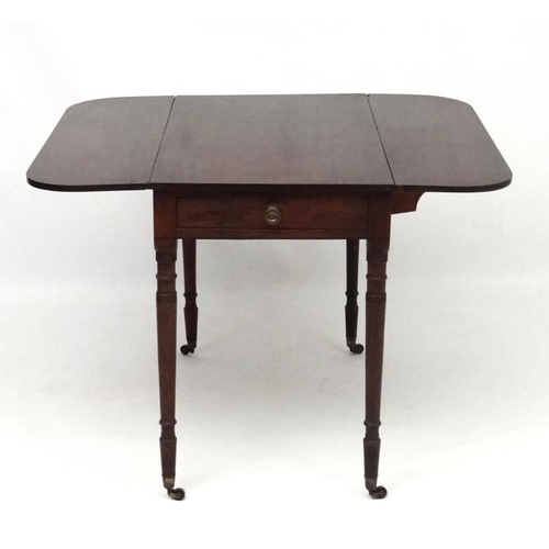 266 - A Geo IV mahogany Pembroke table with one true and one sham drawer. 35'' long