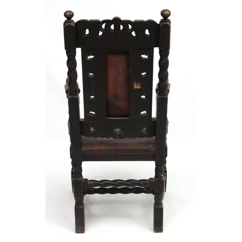 269 - A William and Mary Revival oak chair with embossed leather seat, pack splat and arm pads  leather an... 