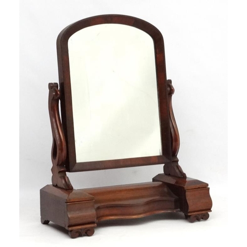 271 - A Victorian mahogany large toilet mirror with central compartment flanked by drawers.  34'' high 26'... 