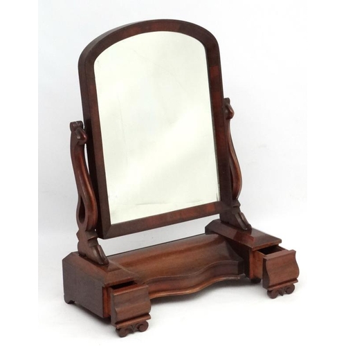 271 - A Victorian mahogany large toilet mirror with central compartment flanked by drawers.  34'' high 26'... 