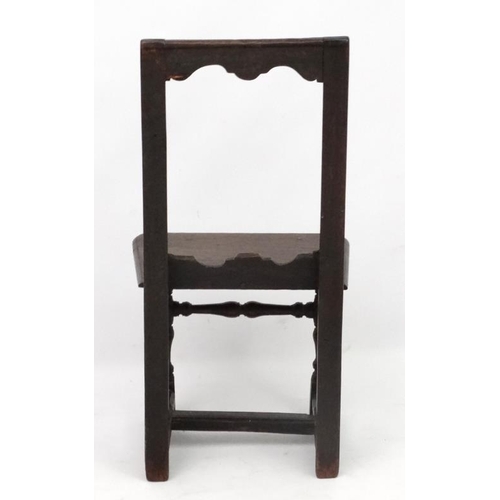 272 - An early 18thC oak peg jointed child's chair . 31 1/4'' high  x 15 1/2'' wide x 12 1/2'' deep