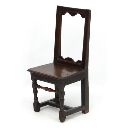 272 - An early 18thC oak peg jointed child's chair . 31 1/4'' high  x 15 1/2'' wide x 12 1/2'' deep