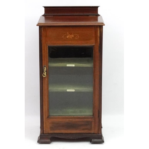 275 - A late 19thC inlaid mahogany bevelled glazed front music cabinet. 38 1/4'' high x 18'' 5/8'' wide x ... 