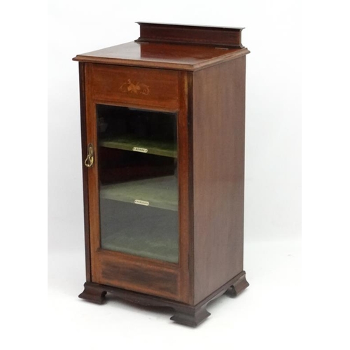 275 - A late 19thC inlaid mahogany bevelled glazed front music cabinet. 38 1/4'' high x 18'' 5/8'' wide x ... 