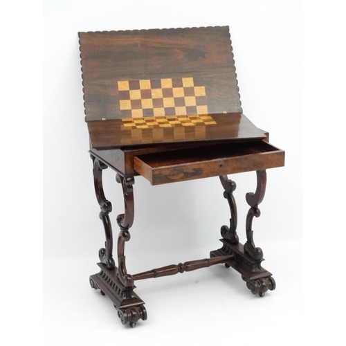 278 - A Regency rosewood games table with fold over top 25 3/4'' wide