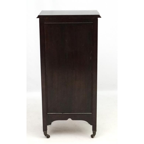 282 - Music cabinet : A c.1900 stained oak tall narrow chest of 8 drawers. The whole 21'' wide x 14 1/3'' ... 