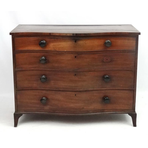 285 - Manner of Gillows : A serpentine fronted mahogany chest of drawers comprising 4 graduate long drawer... 