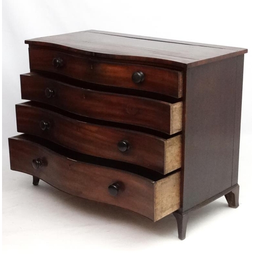 285 - Manner of Gillows : A serpentine fronted mahogany chest of drawers comprising 4 graduate long drawer... 