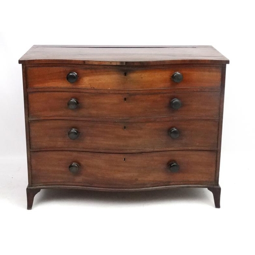 285 - Manner of Gillows : A serpentine fronted mahogany chest of drawers comprising 4 graduate long drawer... 