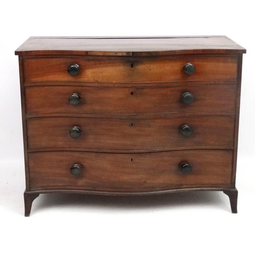 285 - Manner of Gillows : A serpentine fronted mahogany chest of drawers comprising 4 graduate long drawer... 