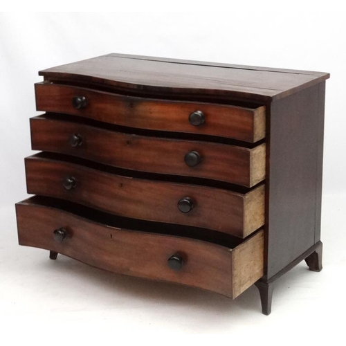 285 - Manner of Gillows : A serpentine fronted mahogany chest of drawers comprising 4 graduate long drawer... 