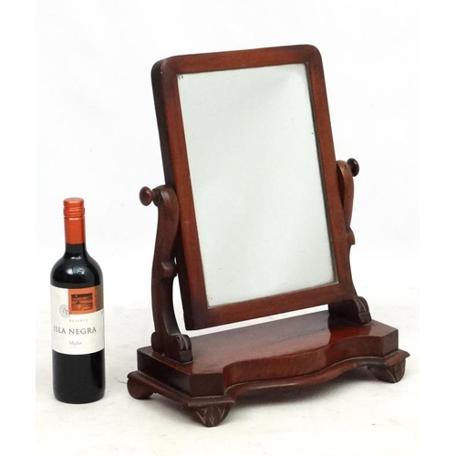 287 - A Victorian mahogany dressing table mirror with serpentine fronted base. 19'' high x 15'' wide