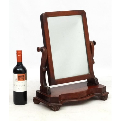 287 - A Victorian mahogany dressing table mirror with serpentine fronted base. 19'' high x 15'' wide