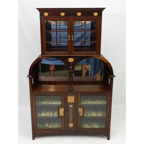 290 - Art Nouveau : An inlaid mahogany cabinet with copper  tulip wood and blonde wood inlay etc. Understo... 